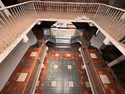 View down into the tiled central court from an upper floor