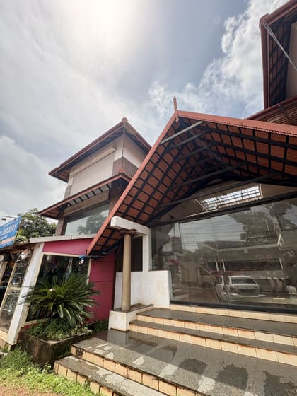 Entrance roof detail and street-facing glass frontage