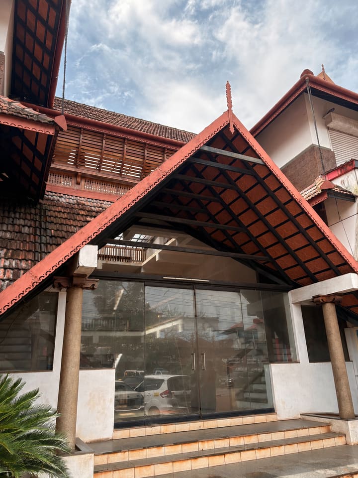 Building front entry roof and steps at nalukettu