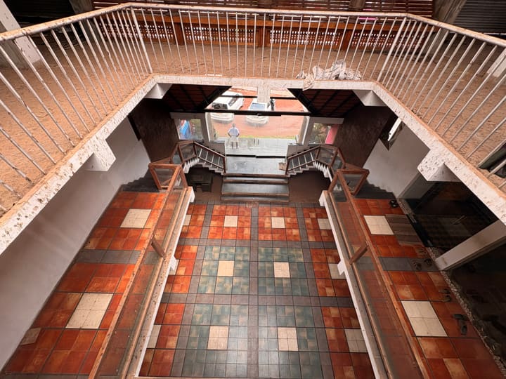 Ground court overlook showing tiled floor and atrium at nalukettu
