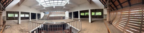 Upper level facing the central court with skylight and open-plan units