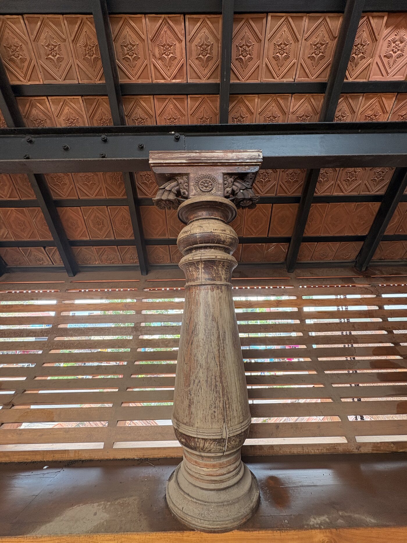 Carved column and timber roof detail